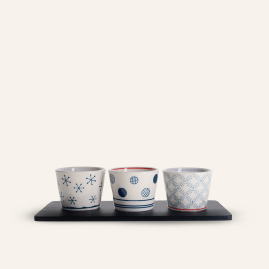 3 round ceramic mugs and indigo-dyed cedar tray
