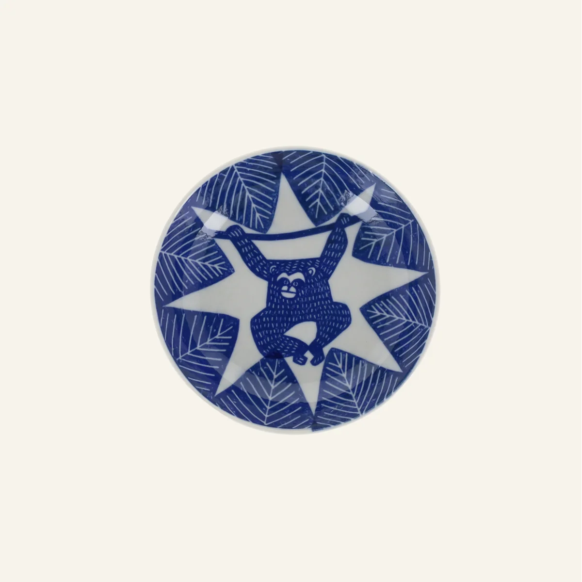 Petite assiette creuse en porcelaine motifs "Singe suspendu"